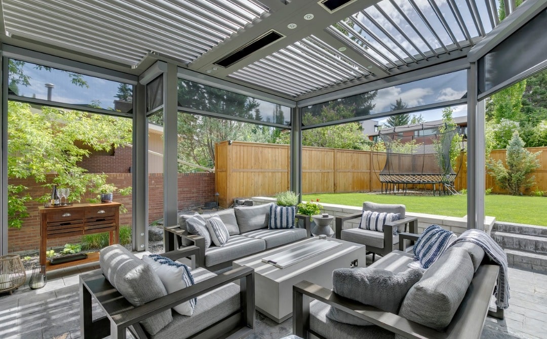 a patio with an all-weather pergola and patio table